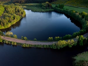 aerial-shot-empty-road-river